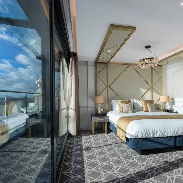 Floor to Ceiling Bespoke Headboard Design in Gold and Beige