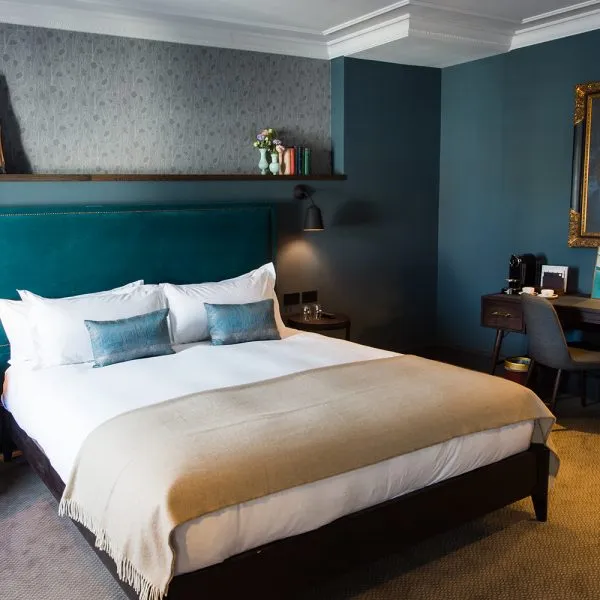 dark bespoke bedroom furniture with brass features