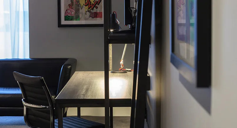 Minimal dark rustic desk design with wall mounted tv
