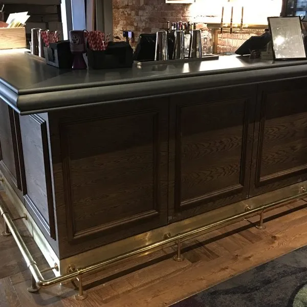 dark bespoke bar design with fielded panel detail