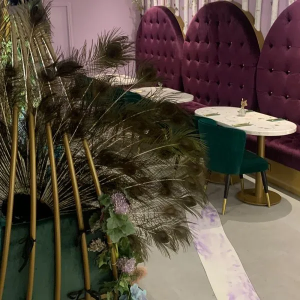 round bespoke banquette seating in purple with deep buttoning